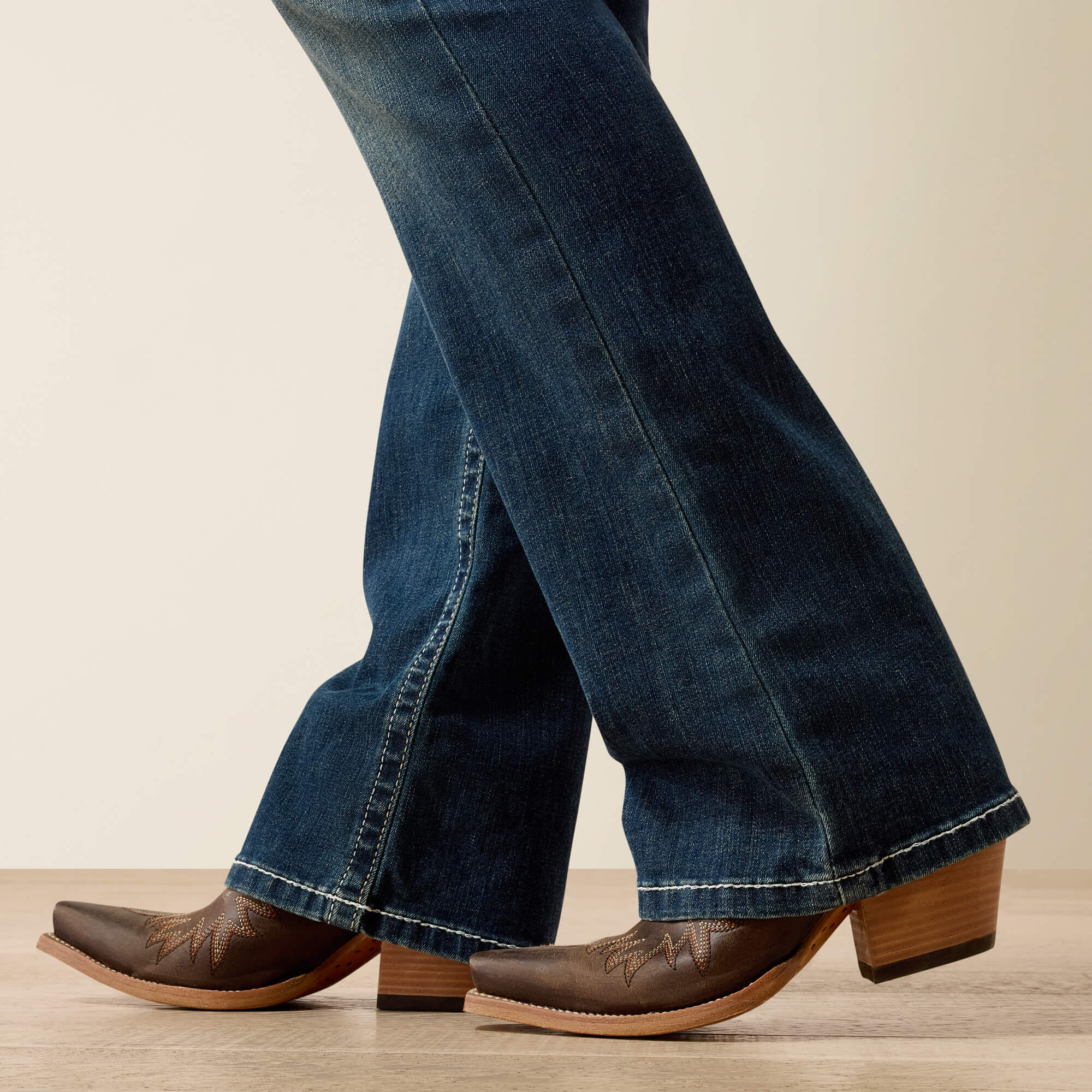 R.E.A.L. Mid Rise Stretch Whipstitch Boot Cut Jean